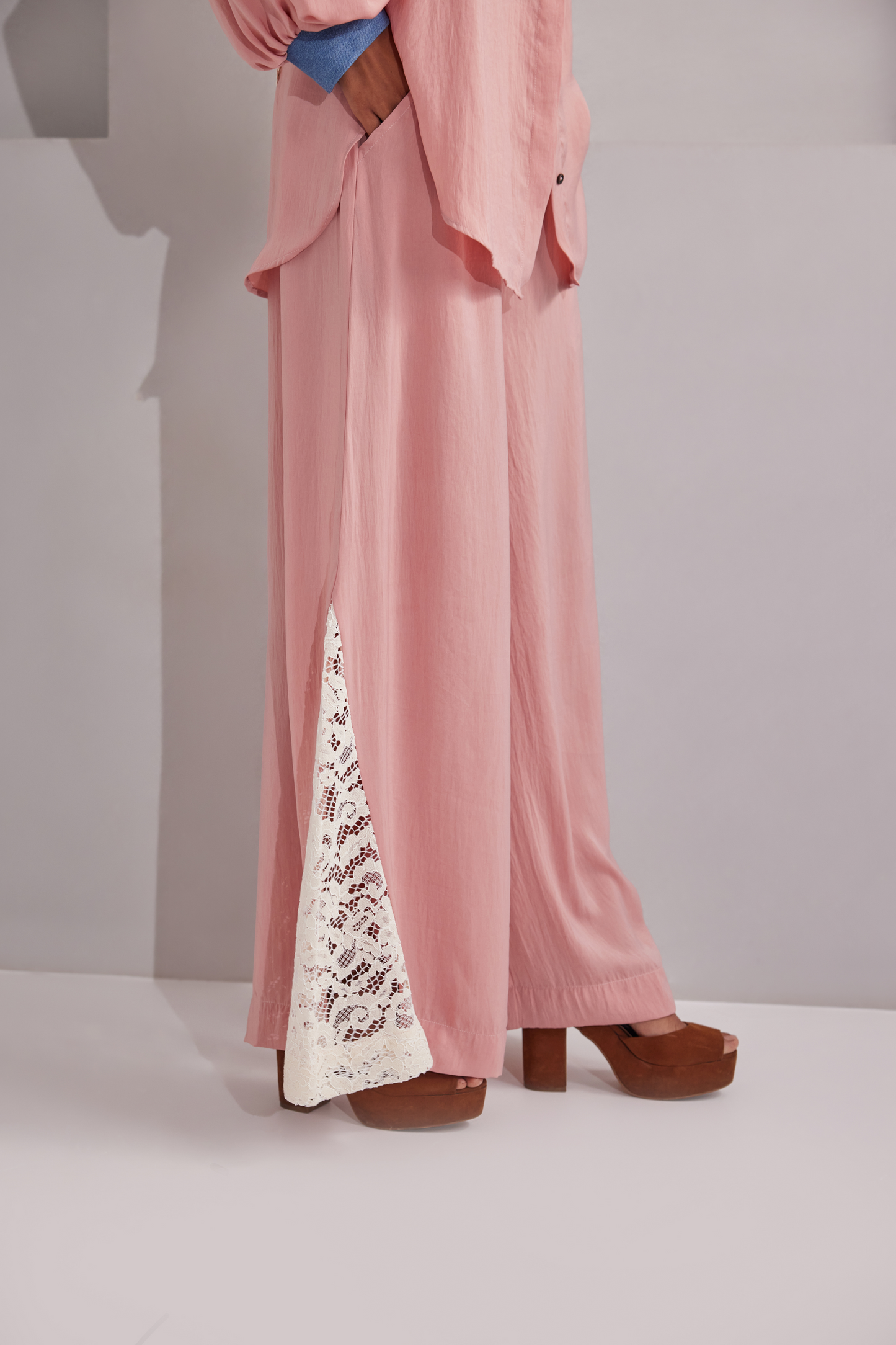 Front button closure, Denim collared shirt with 2 pockets on front, Padded shoulders with denims and balloon sleeves. White net design at the back. Flared pants with netted patches on side bottoms