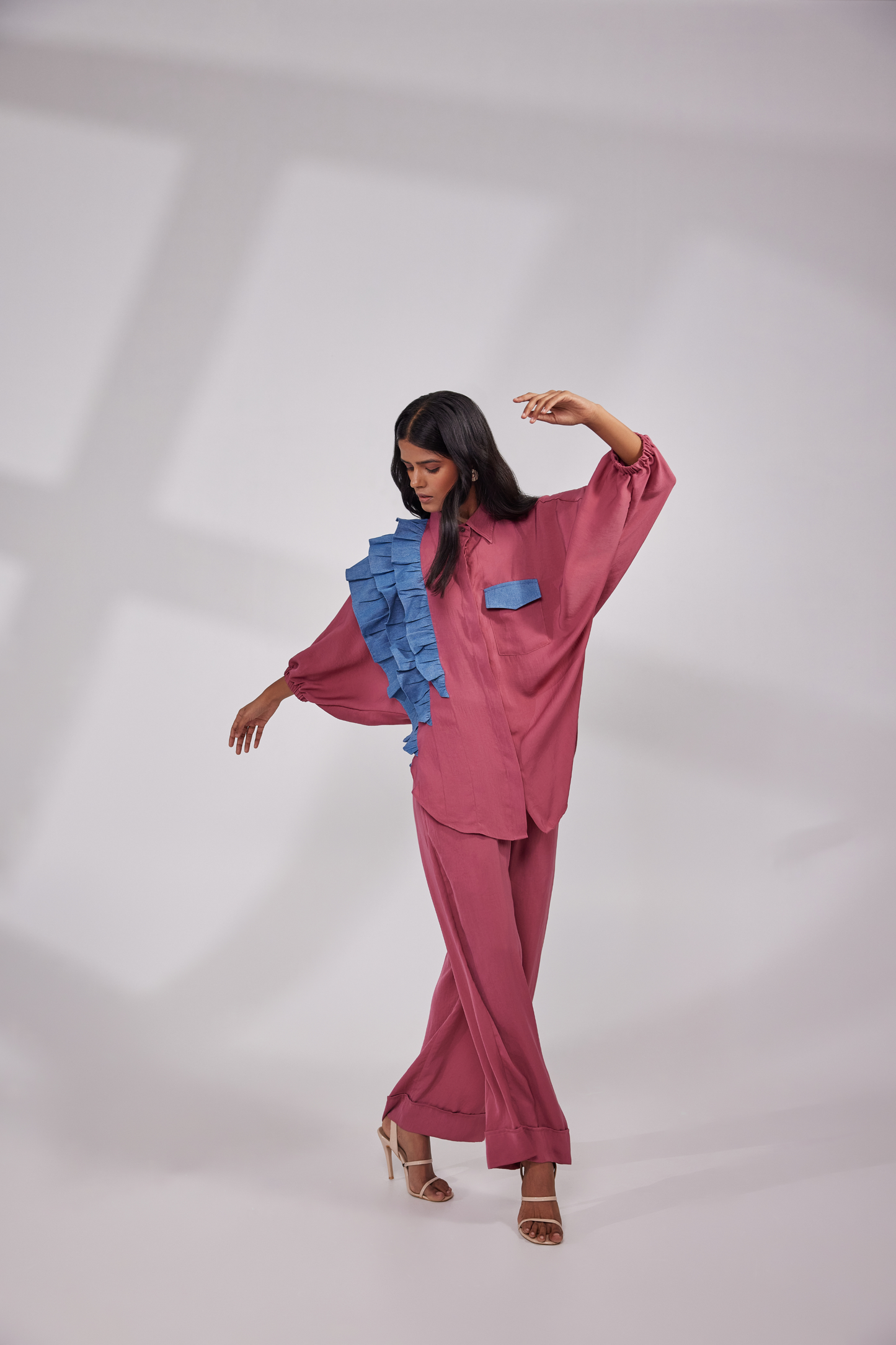 Balloon sleeves shirt having decorative frills on one side and flared pants with pockets