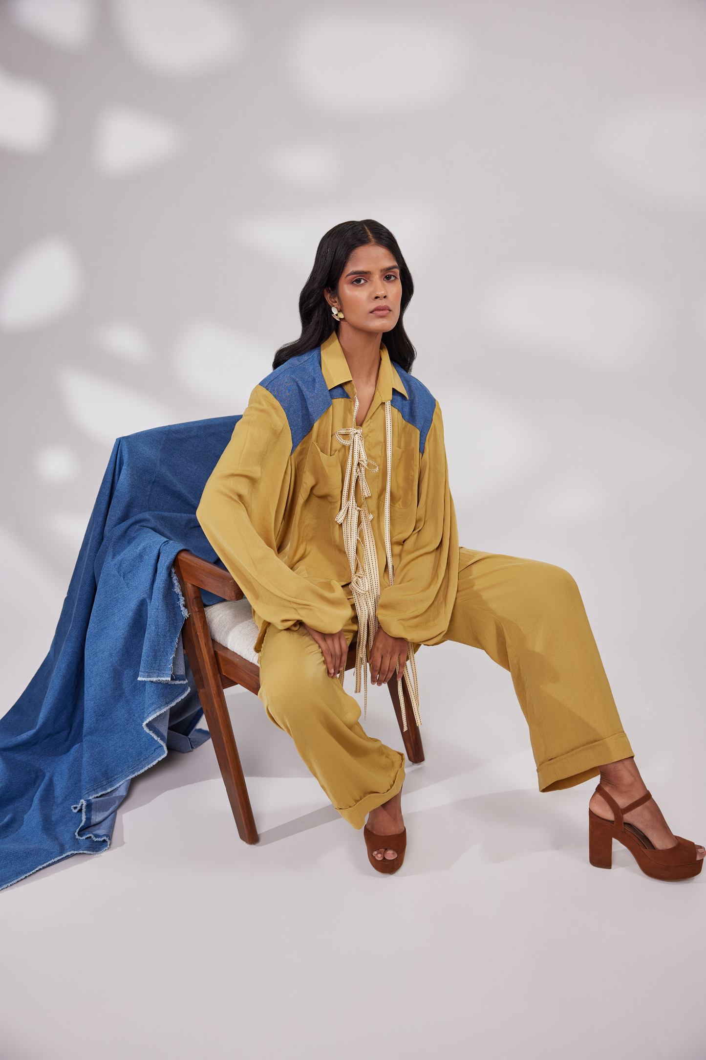 Full sleeves collared shirt with ribbon instaed of buttons and denim patches on shoulder, and pocket pants