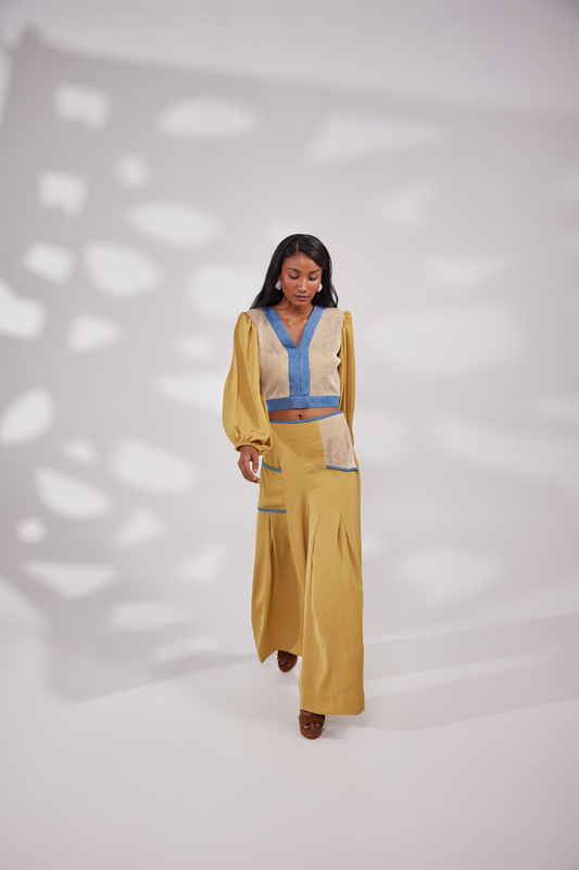 Balloon sleeve V neck top with denim and netted design on the front. Flared pants with a unique netted pockets on the sides